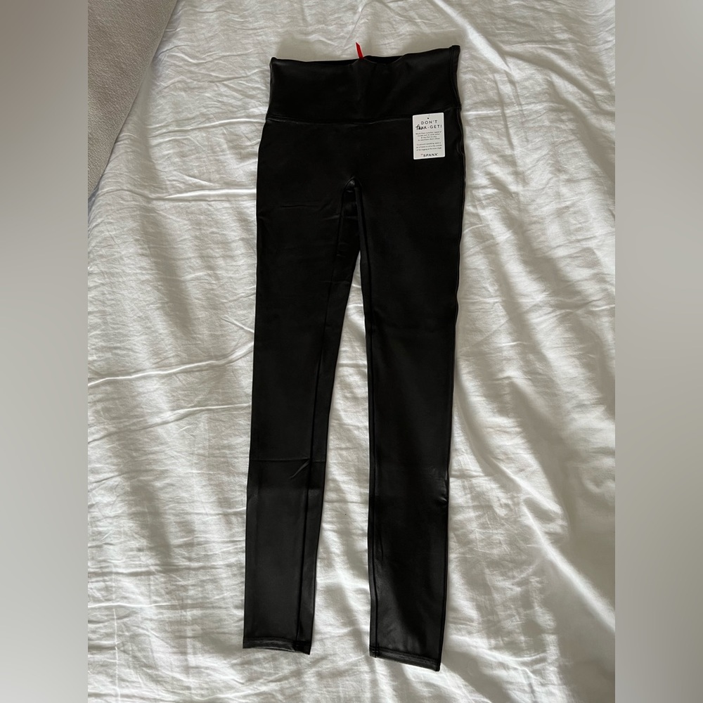 Never worn NWT black Spanx faux leather leggings, size small
